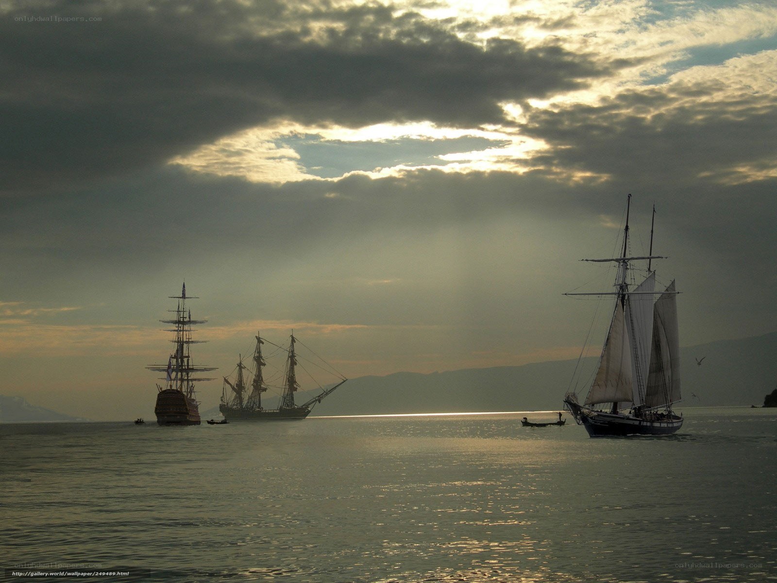 Sailboats at sunset on the water