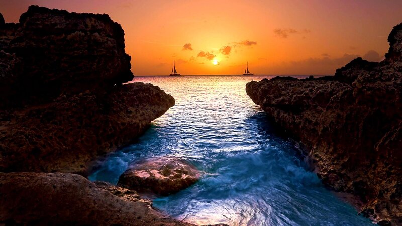 Sailboats at Sunset — Orange, Serene, Photograph, Rocks, Ocean