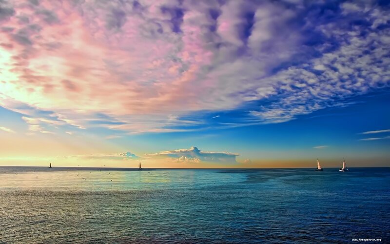 Sailboats at sunset over the sea