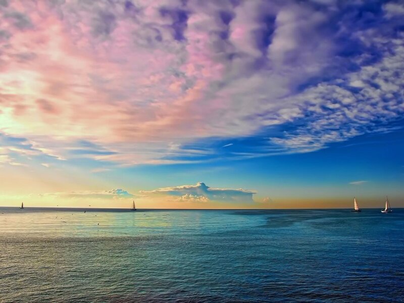 Sailboats at sunset over the sea