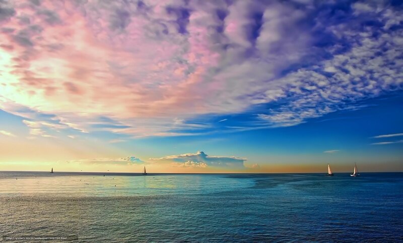 Sailboats at sunset over the sea