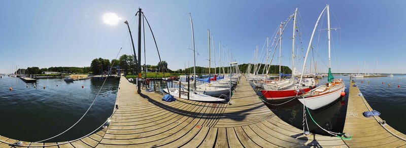Sailboats docked at a marina