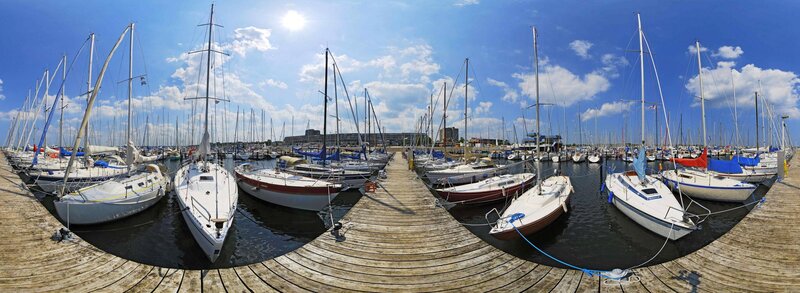Sailboats docked at marina