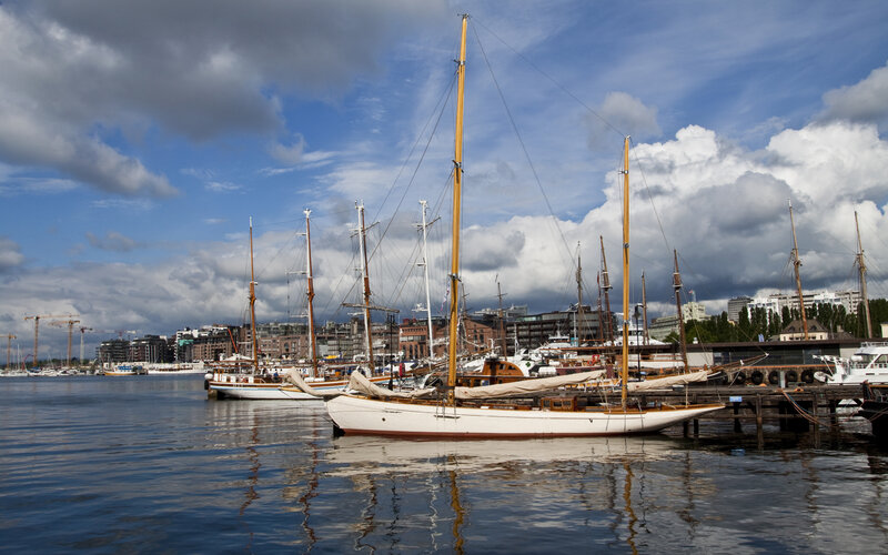 Sailboats docked in a harbor