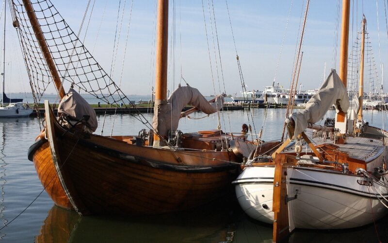 sailboats docked in harbor