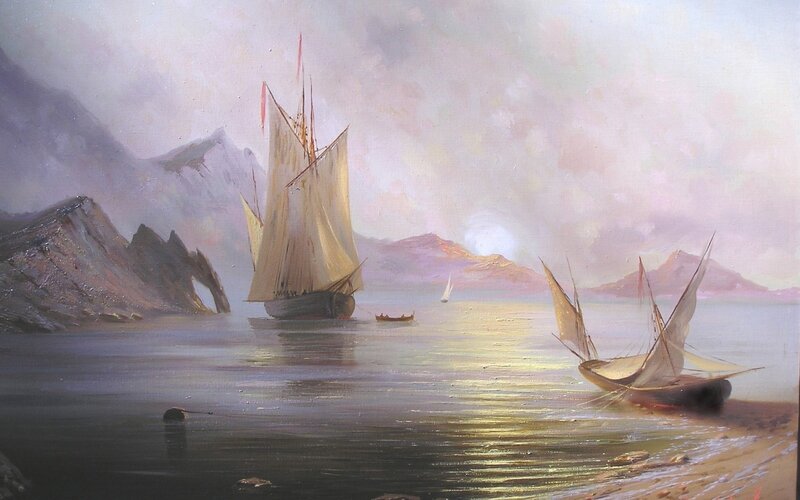 Sailboats in a mountainous bay