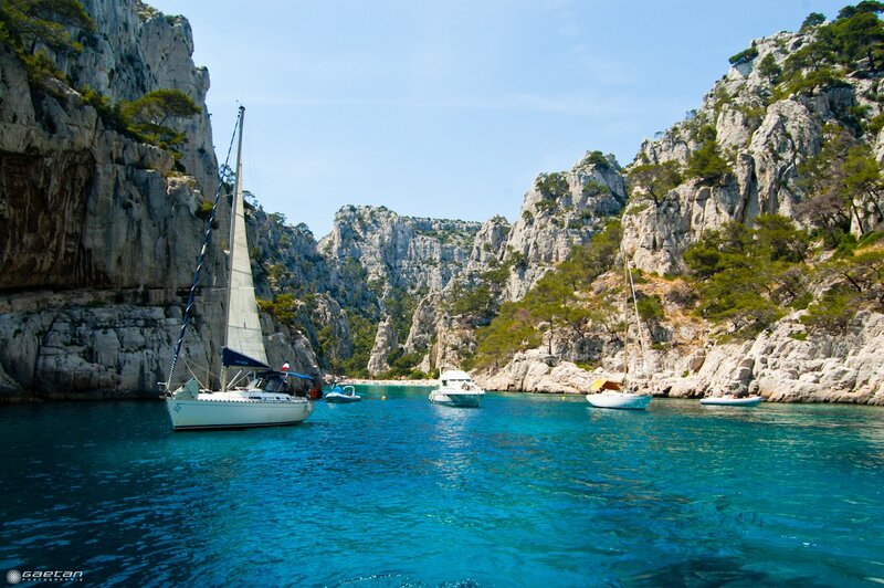Sailboats in a rocky cove