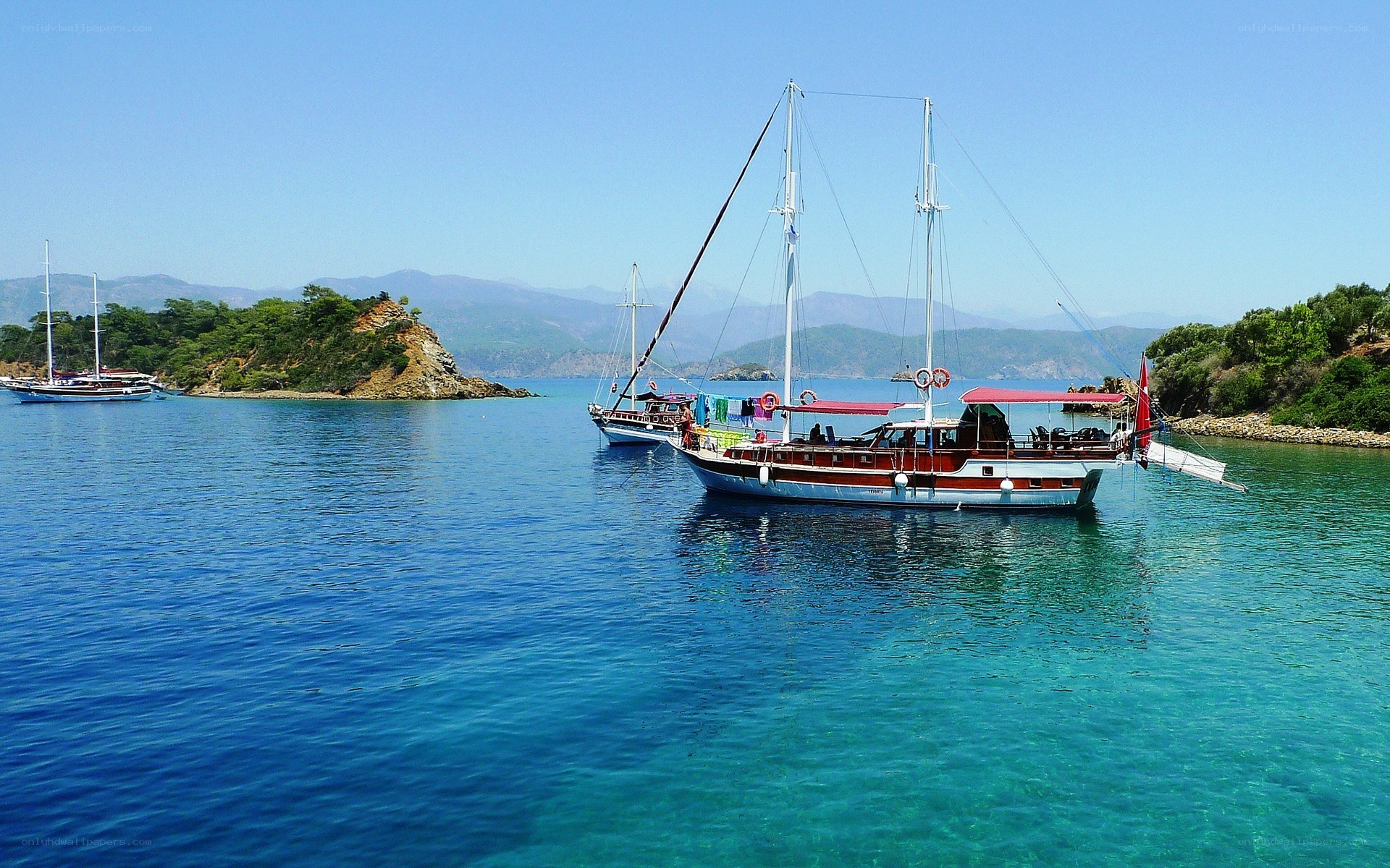 Sailboats in a turquoise bay