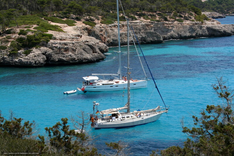 Sailboats in a turquoise cove