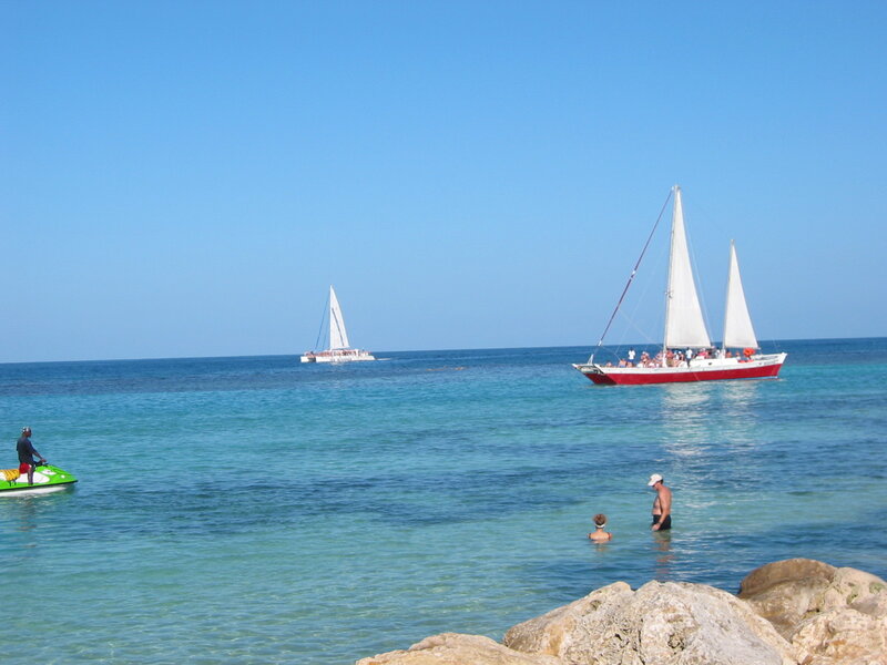 Sailboats in clear blue water