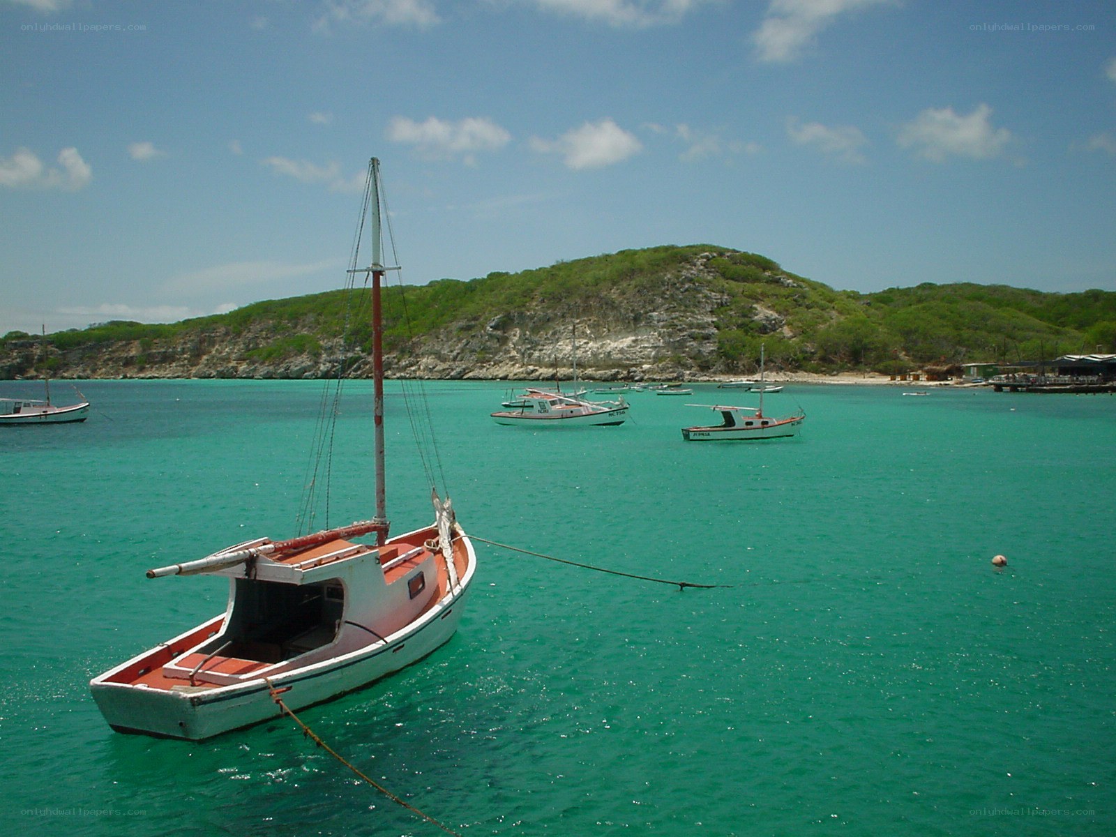 Sailboats in turquoise bay