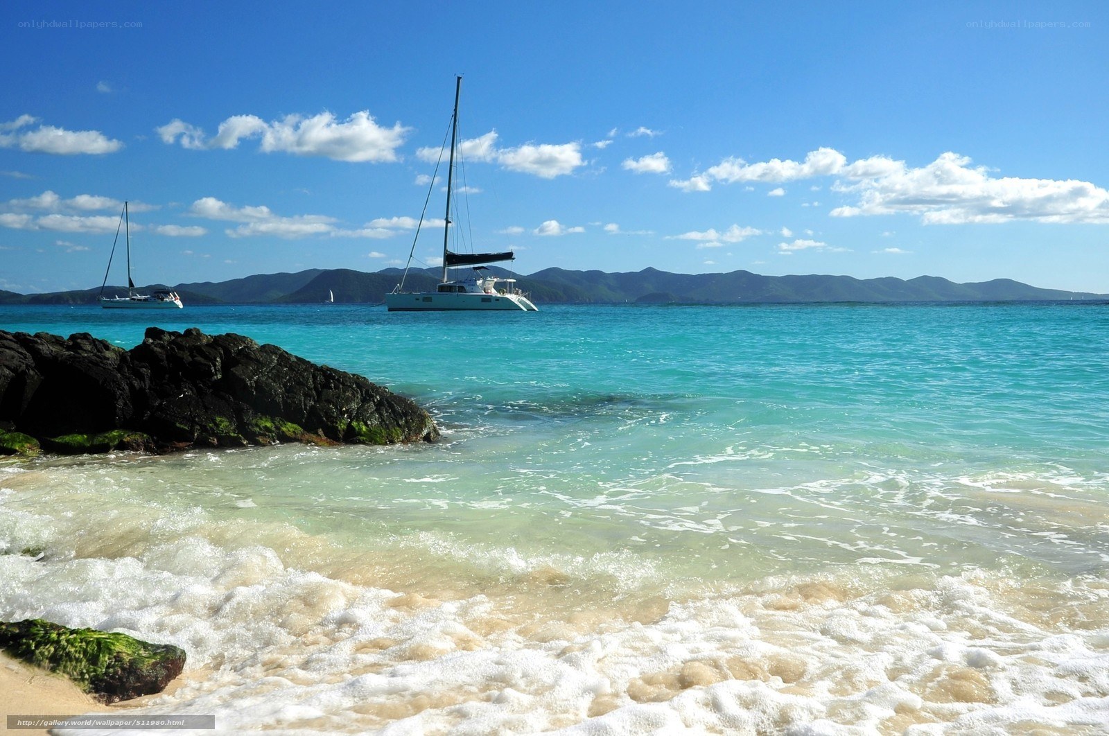 Sailboats in turquoise bay