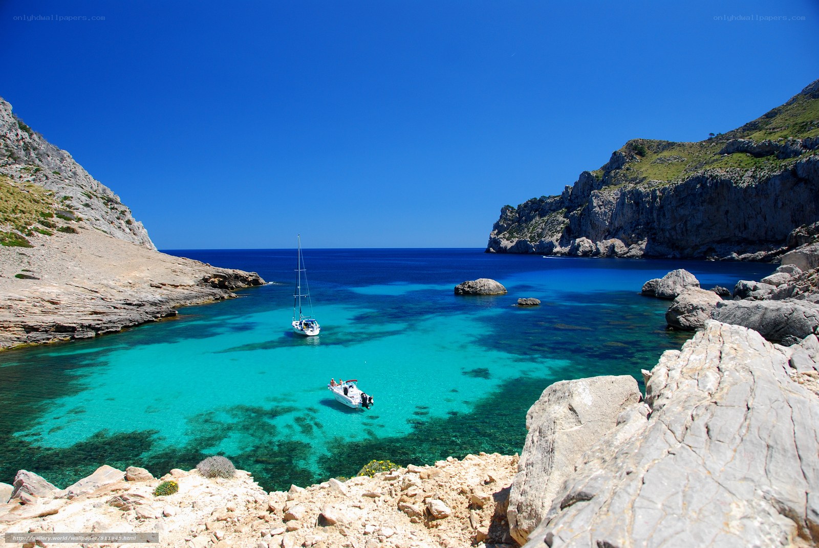 sailboats in turquoise cove