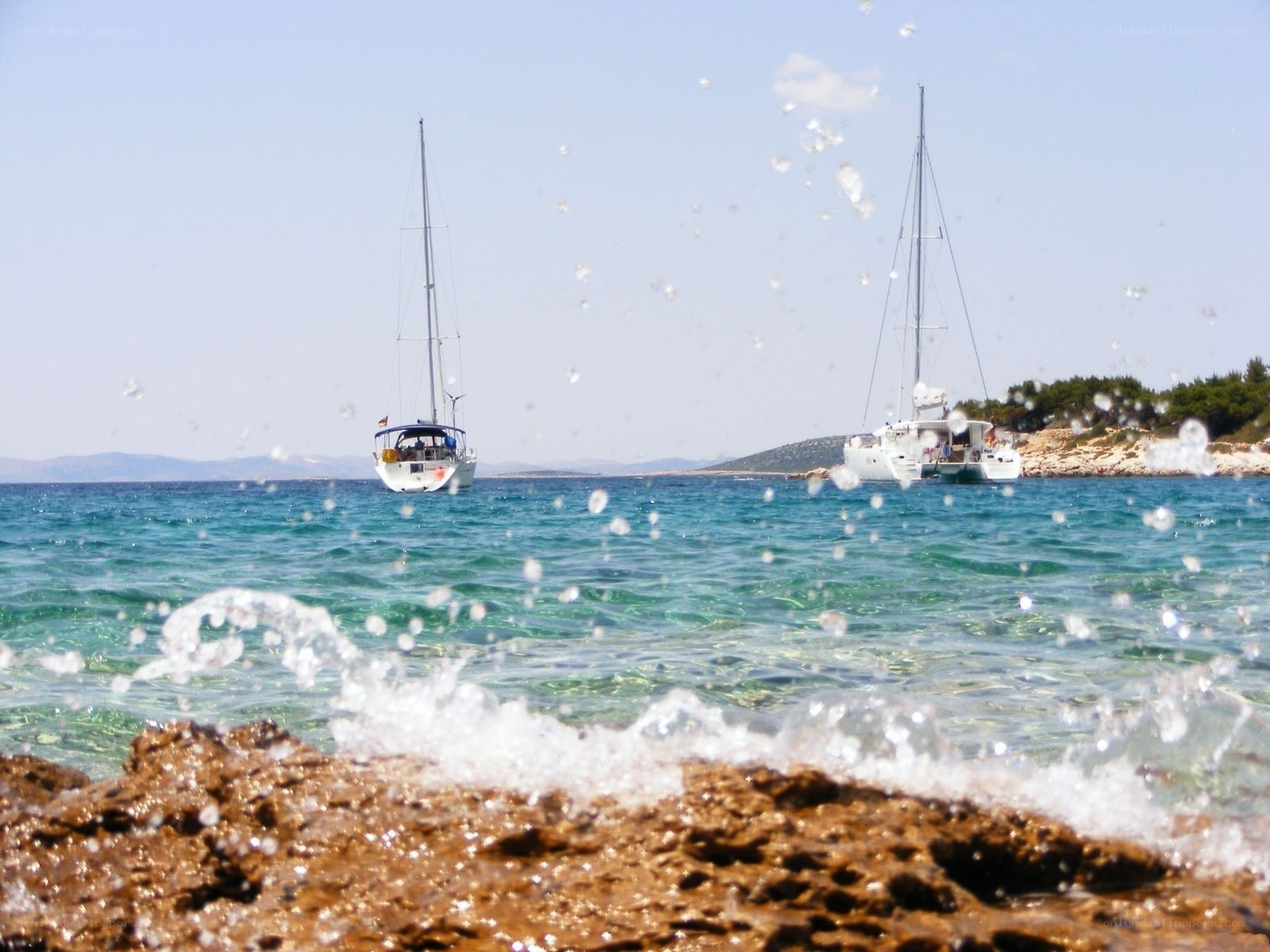 Sailboats in turquoise waters