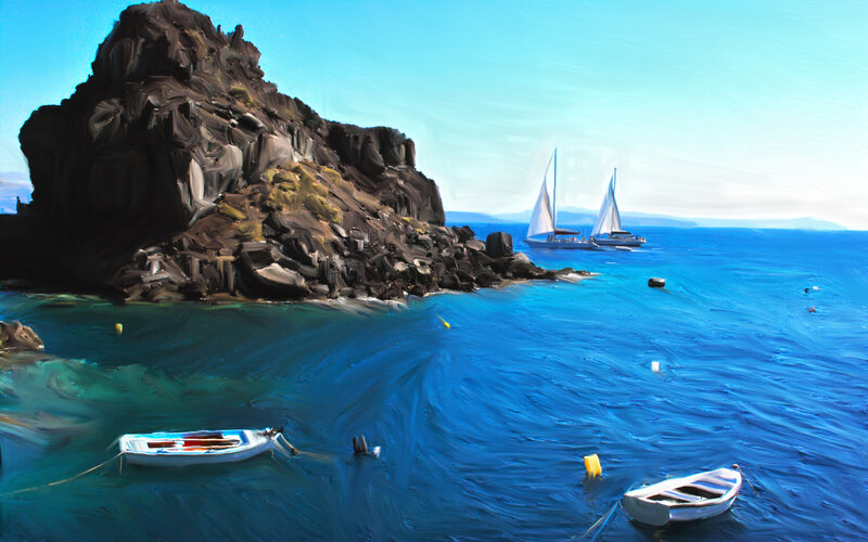 Sailboats near rocky coast