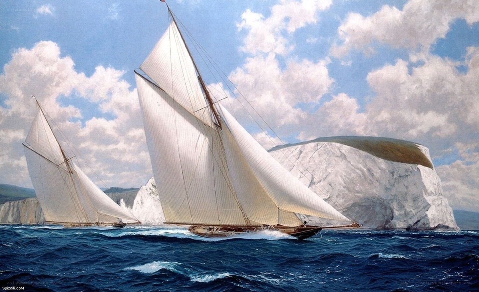 Sailboats near white cliffs