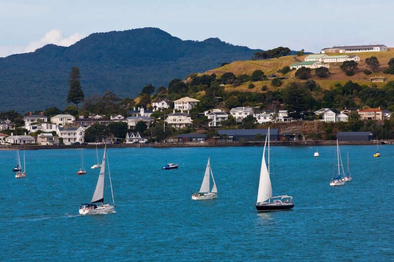 Sailboats on a bay with hills