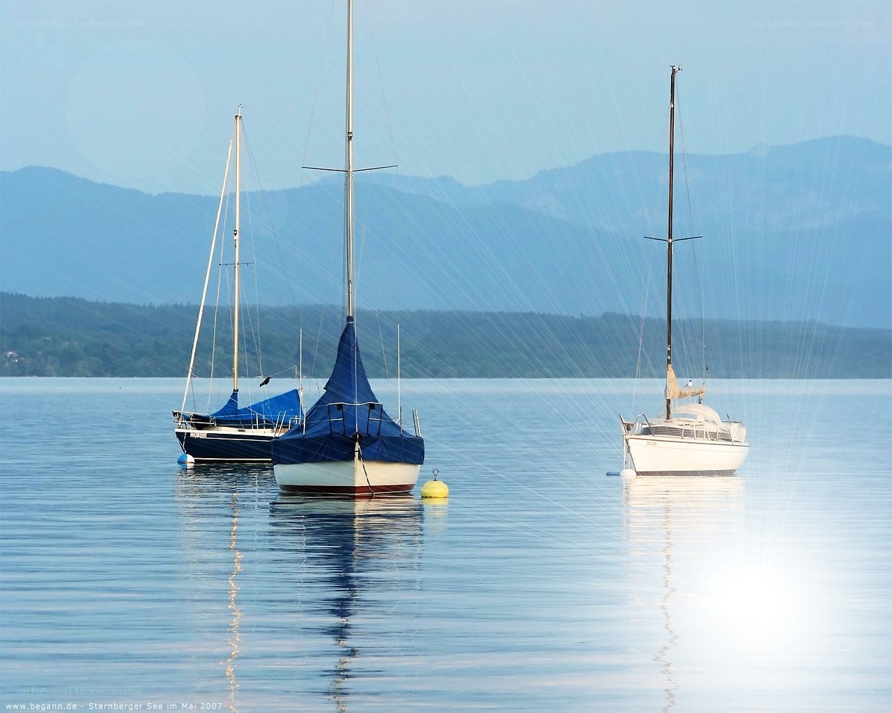 Sailboats on a calm lake