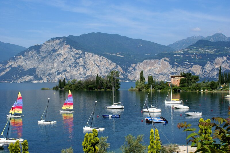 Sailboats on a lake with mountains