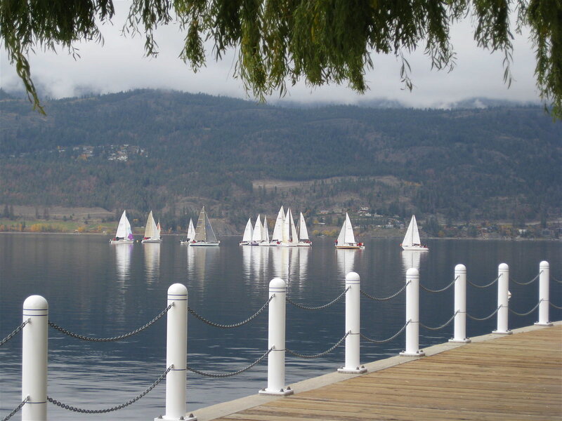 Sailboats on a lake with mountains