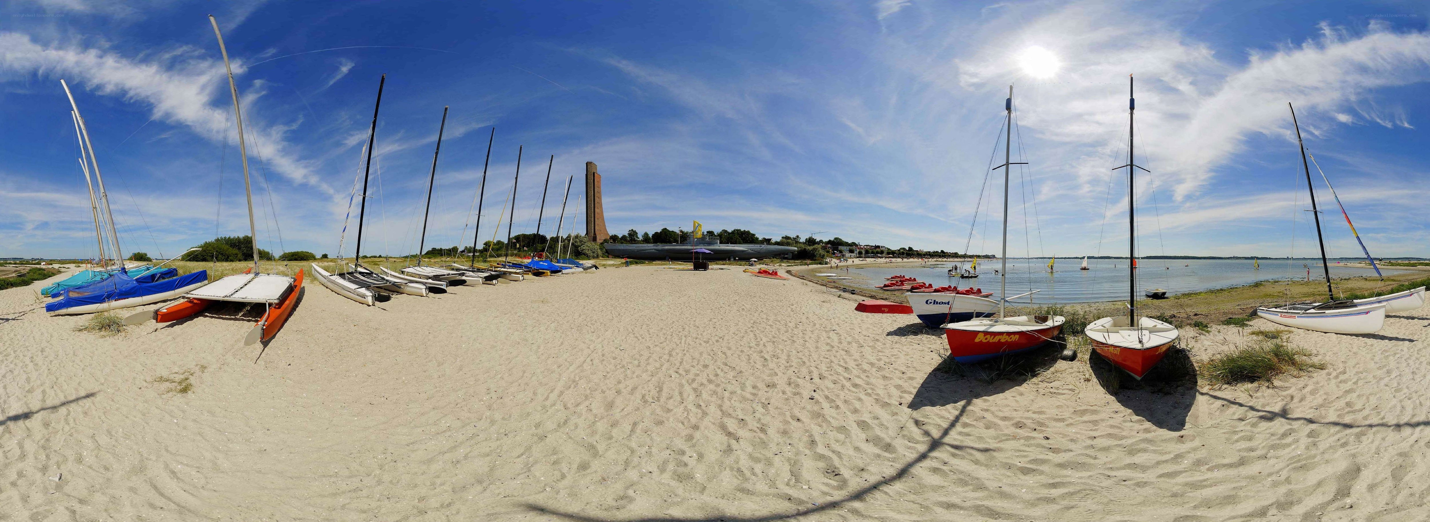 Sailboats on a sandy beach