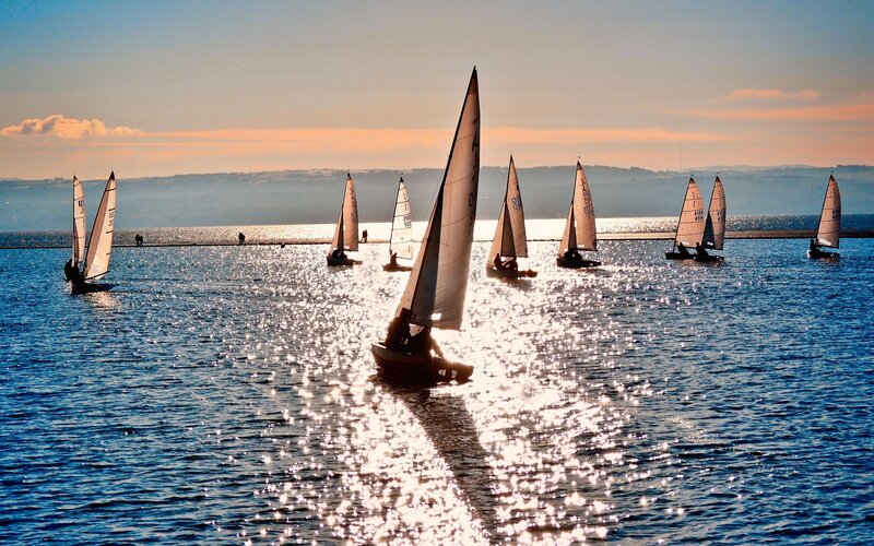 Sailboats on a sparkling lake