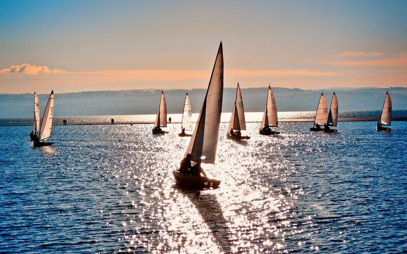 Sailboats on a sparkling lake