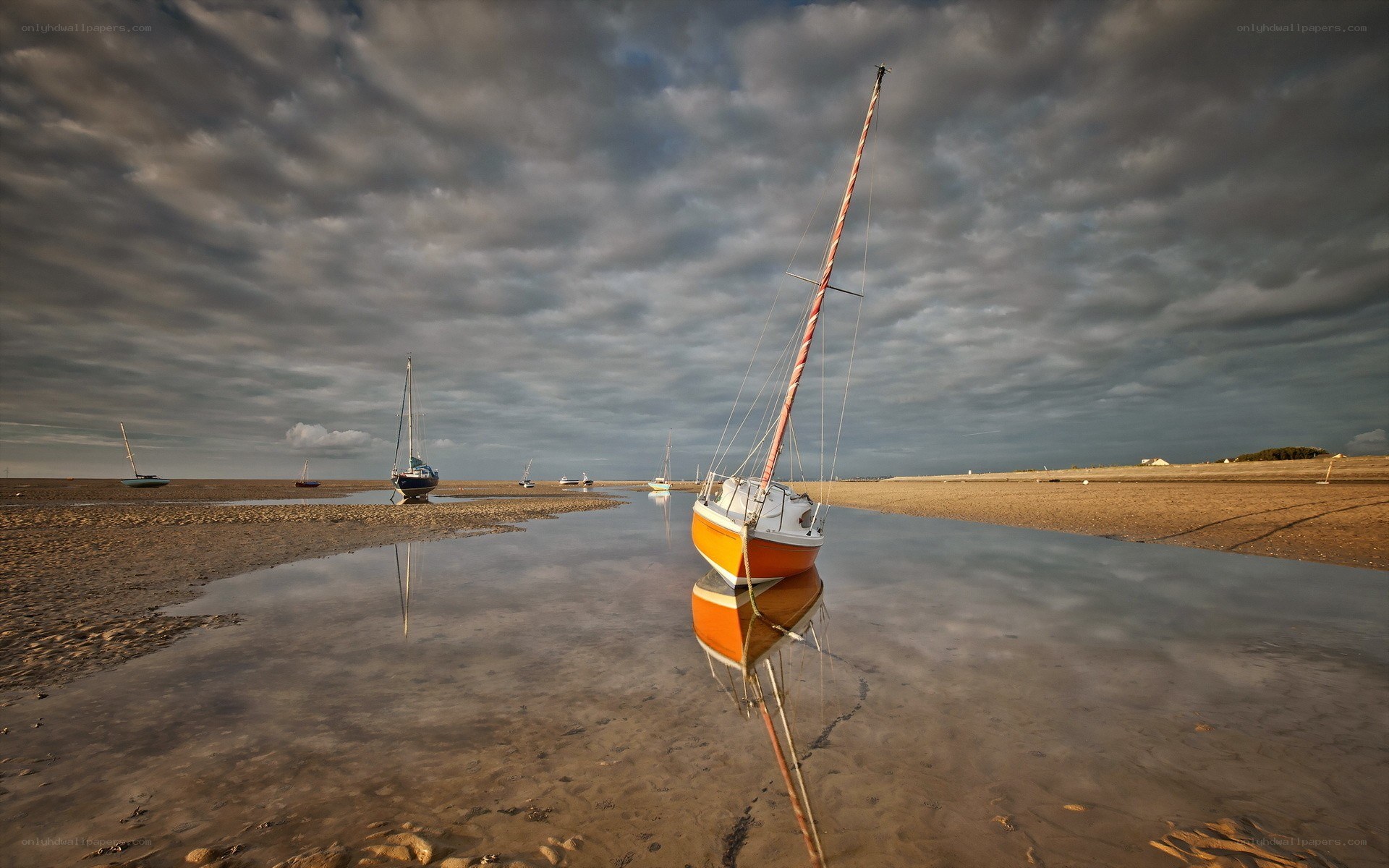 Sailboats on a tidal flat