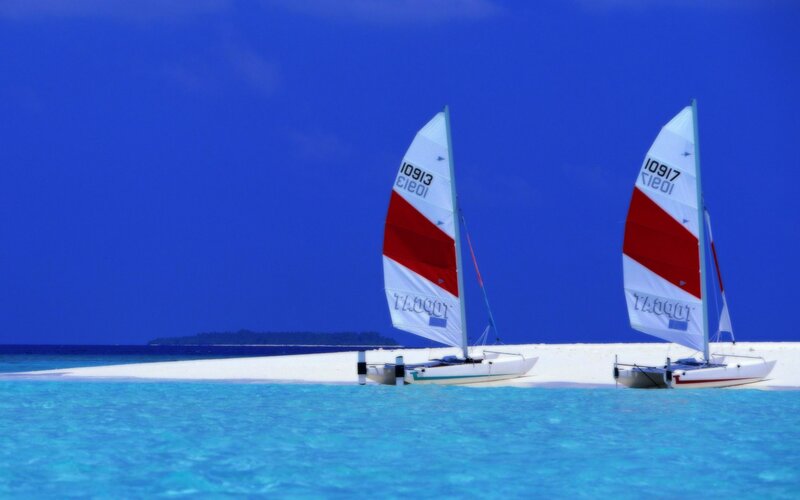 Sailboats on a tropical beach