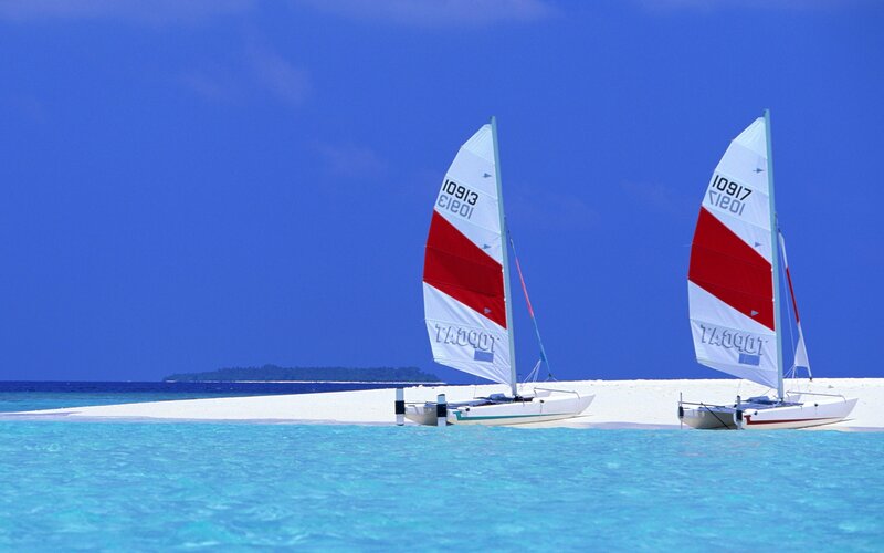 Sailboats on a tropical beach