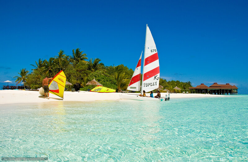 Sailboats on a tropical beach