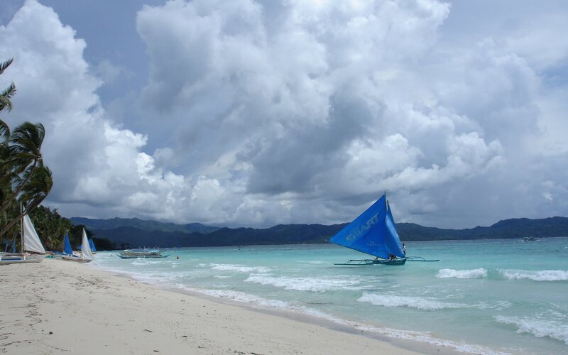 Sailboats on a tropical beach
