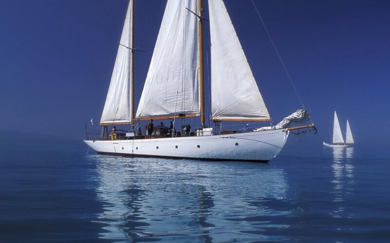 Sailboats on calm blue sea