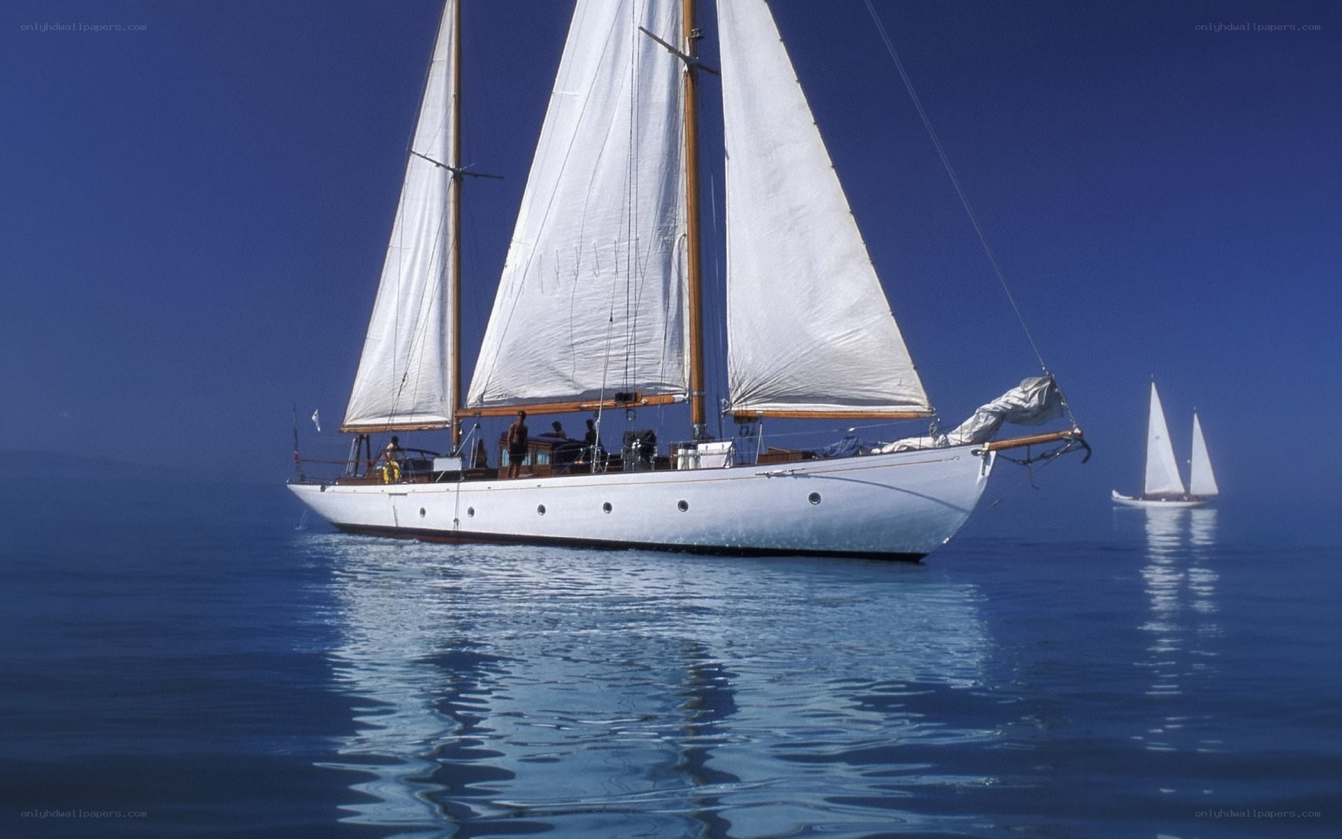 Sailboats on calm blue sea
