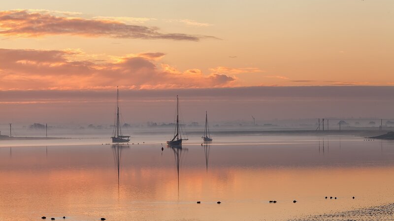 Sailboats on Calm Water — Orange, Serene, Sunrise, Photograph, Reflection