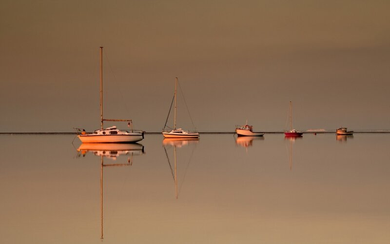 Sailboats on Calm Water — Orange, Serene, Sunset, Photograph