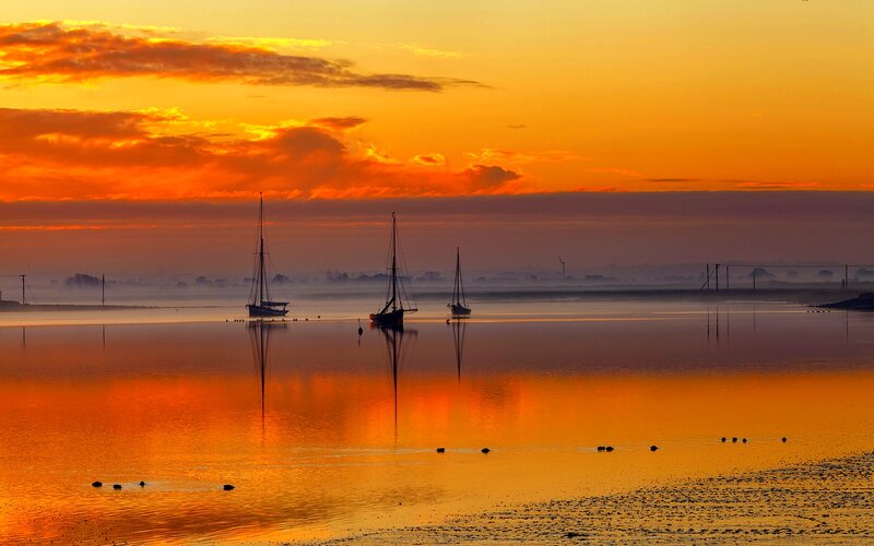 Sailboats on Calm Water — Orange, Serene, Sunset