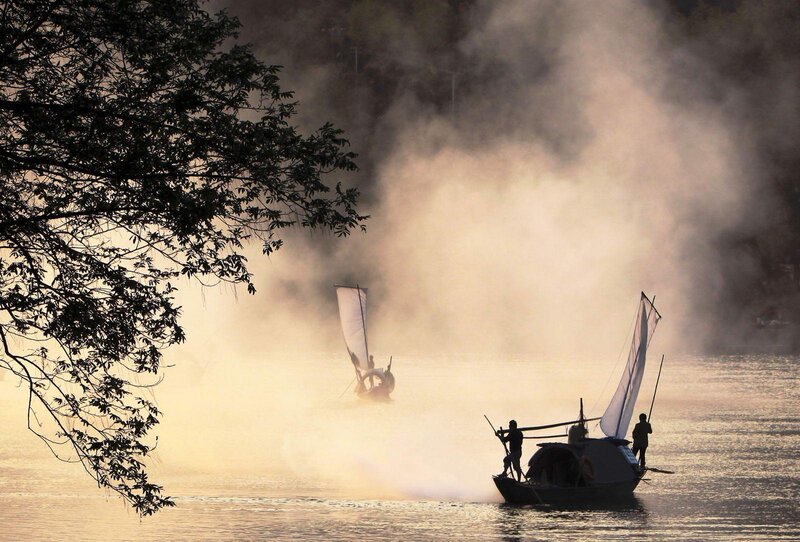 Sailboats on Misty River