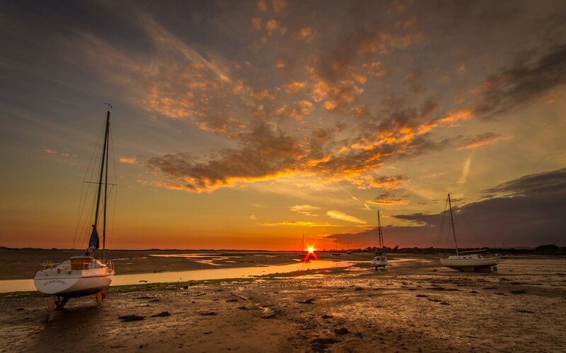 Sailboats on Mudflats — Orange, Dramatic, Sunset