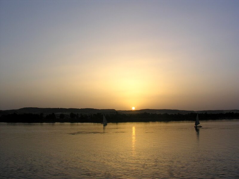 Sailboats on River at Sunset