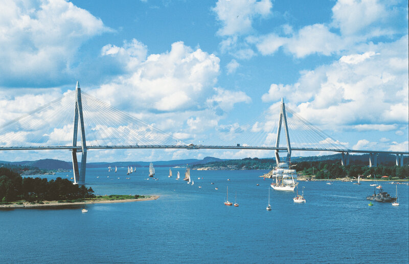 Sailboats under a cable-stayed bridge