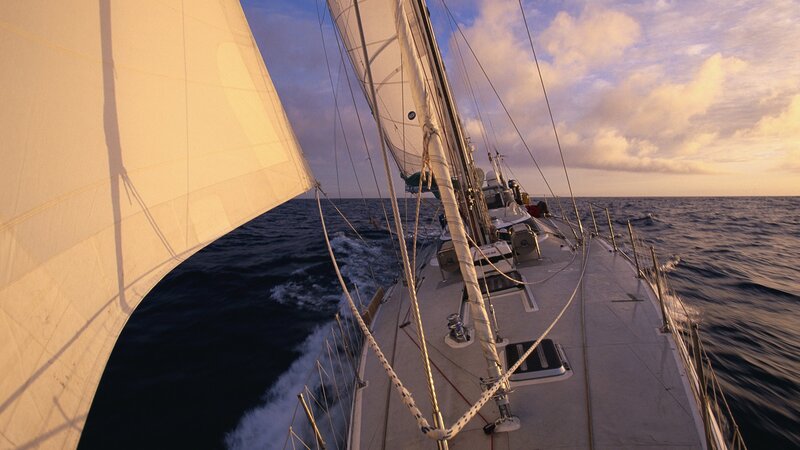 Sailing at sunset on the open sea