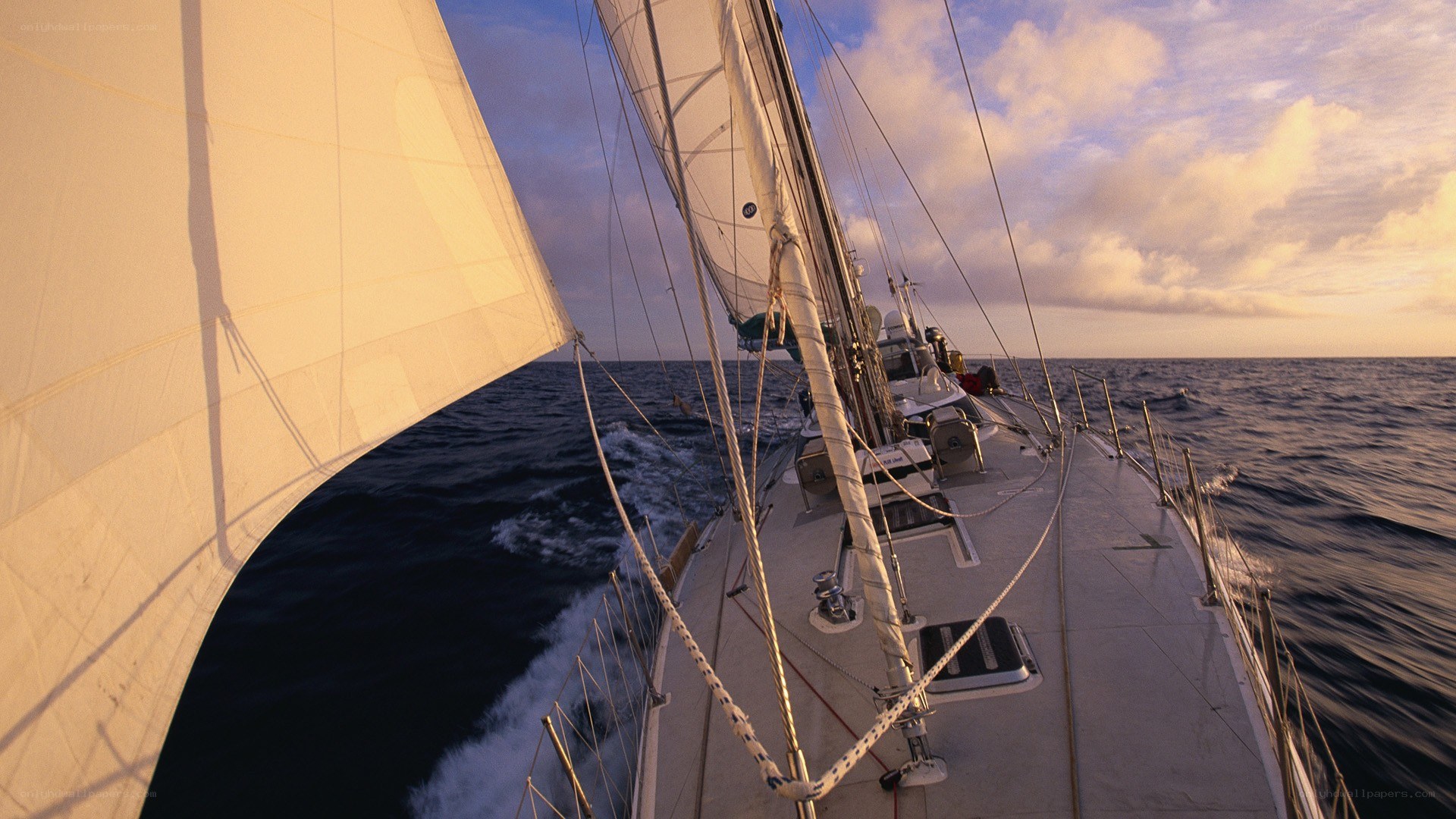 Sailing at sunset on the open sea