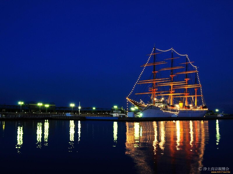 sailing ship at night in port
