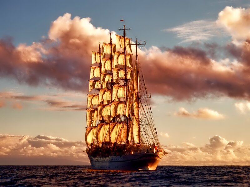 Sailing Ship at Sea — Blue, Dramatic, Sunset, Photograph, Ocean, Sky