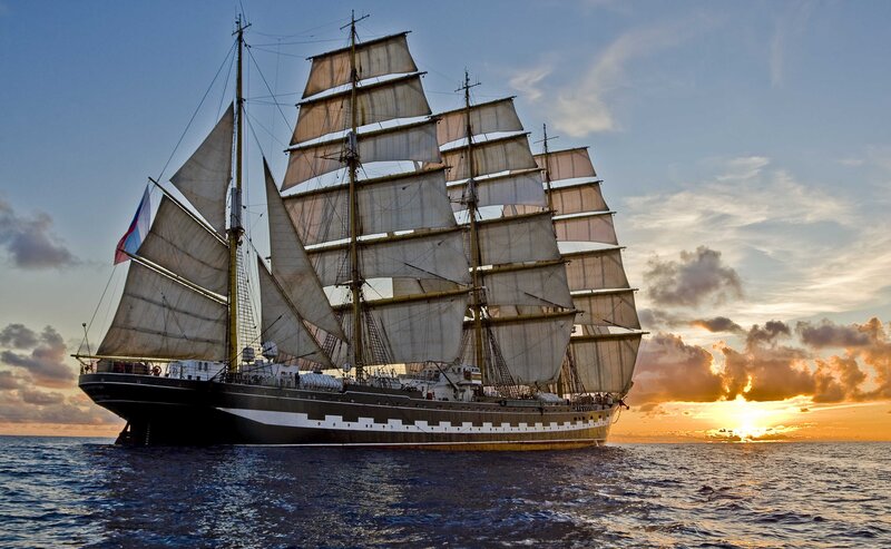 Sailing Ship at Sea — Blue, Dramatic, Sunset, Photograph, Sails