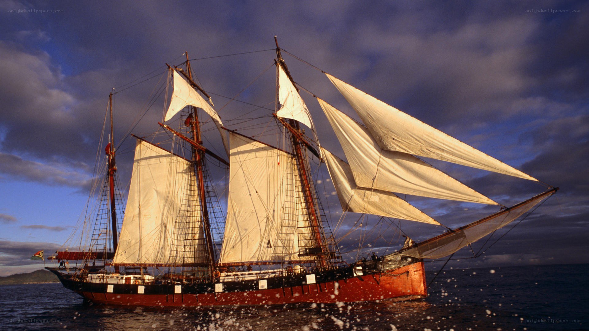 sailing ship at sunset