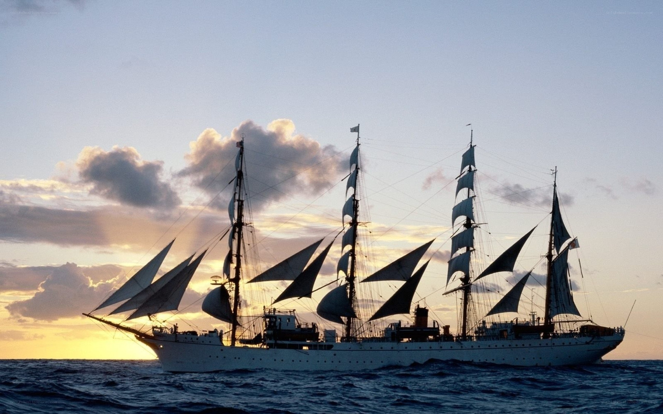 sailing ship at sunset