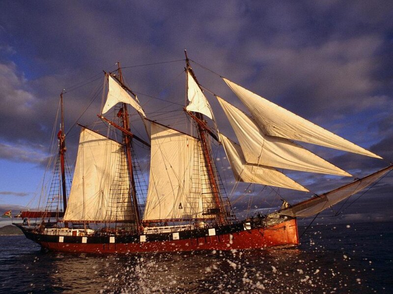 sailing ship at sunset