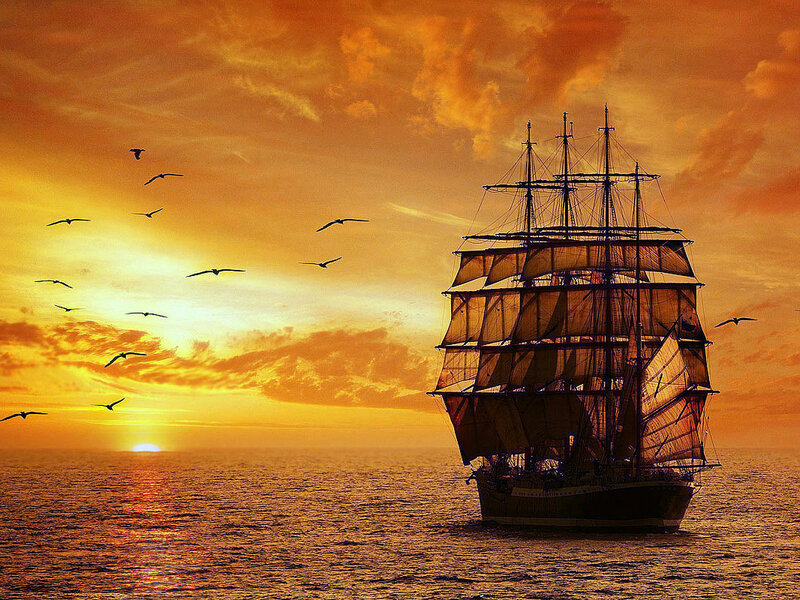 Sailing Ship at Sunset — Orange, Dramatic, Photograph